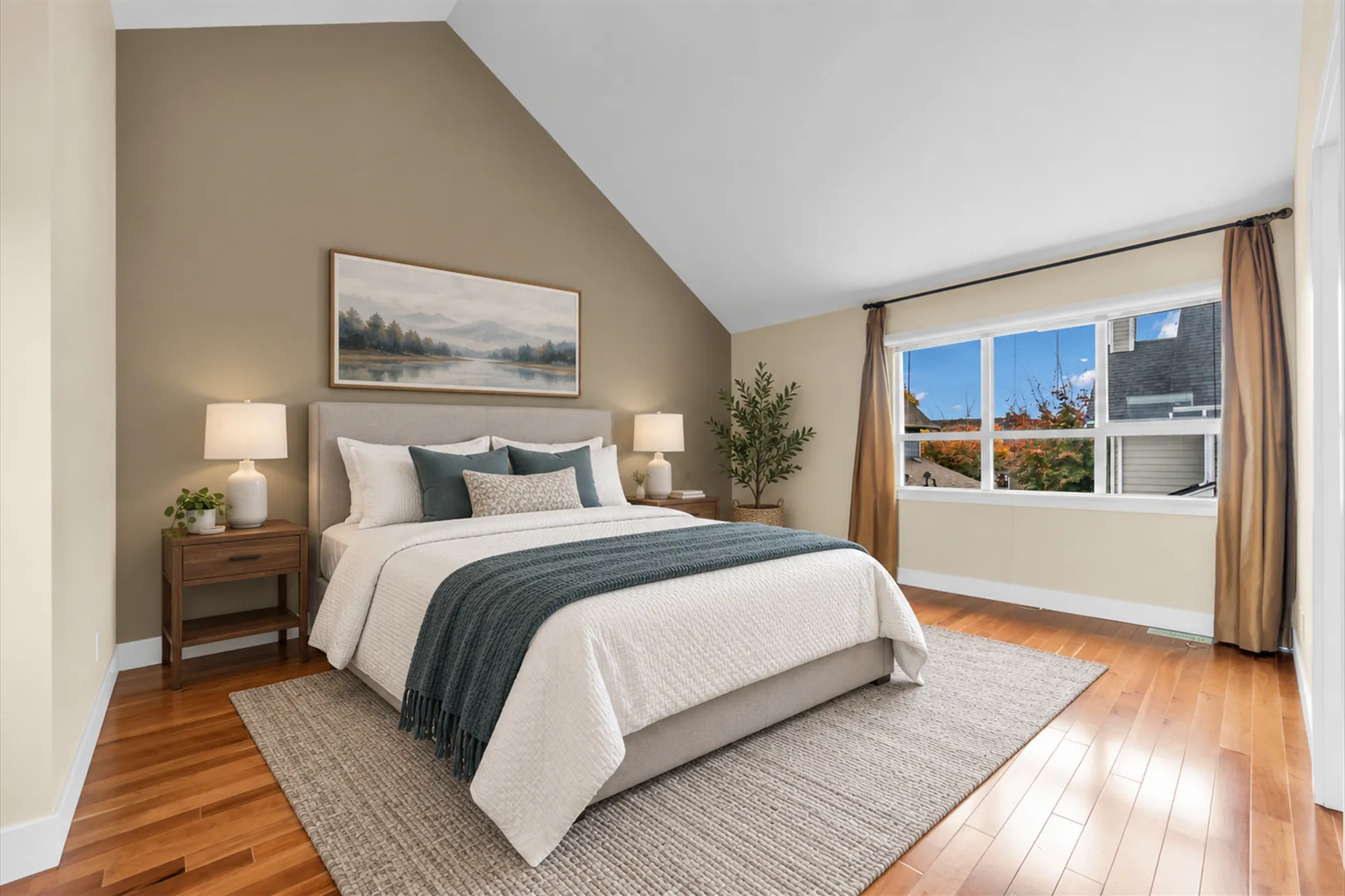 The same frame virtually staged: an upholstered bed with white bedding and a teal throw, two night tables with lamps, a rug, an olive tree, a landscape print